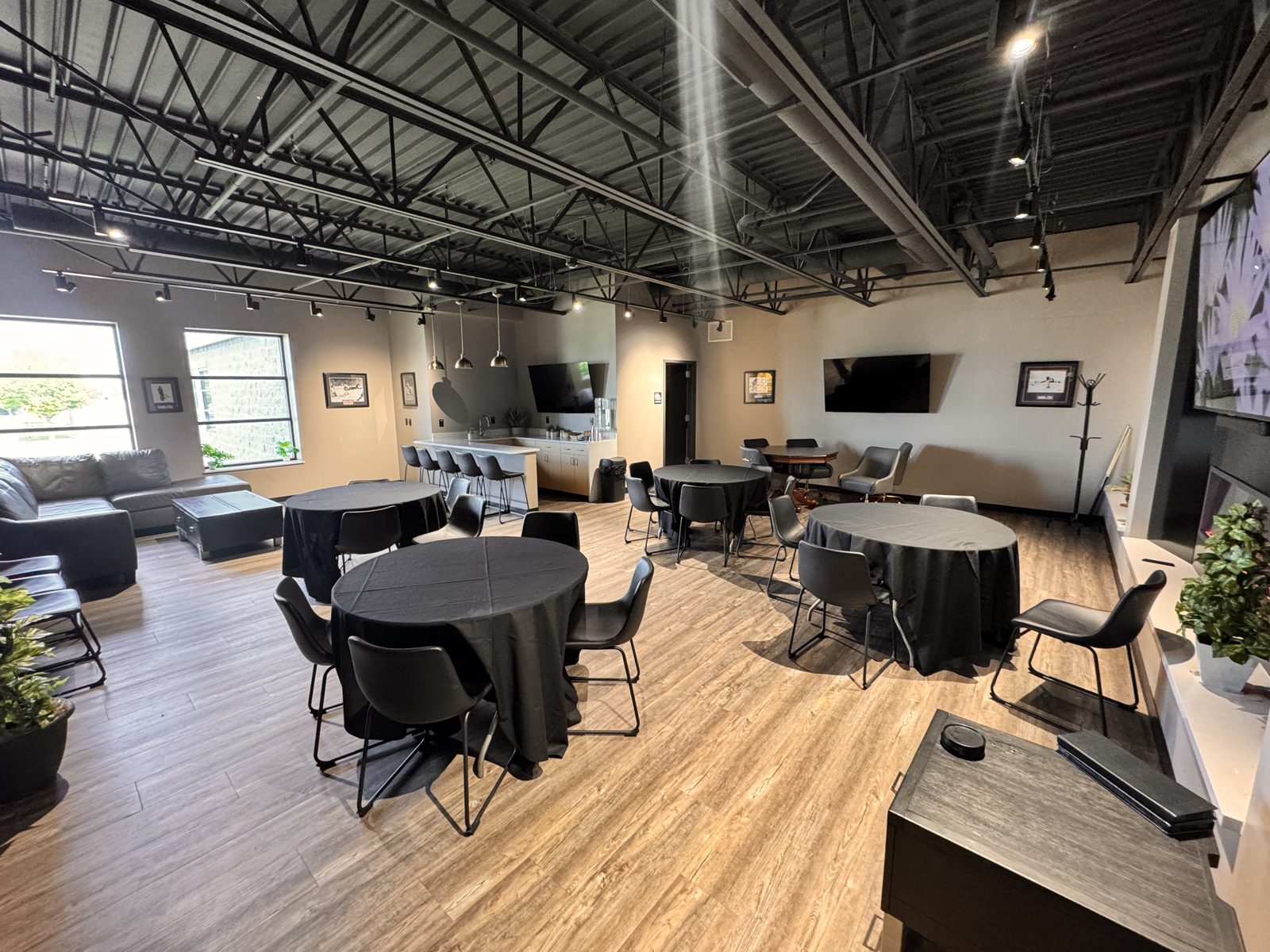 The Executive Suite at The Venue, set with lounge seating and TVs